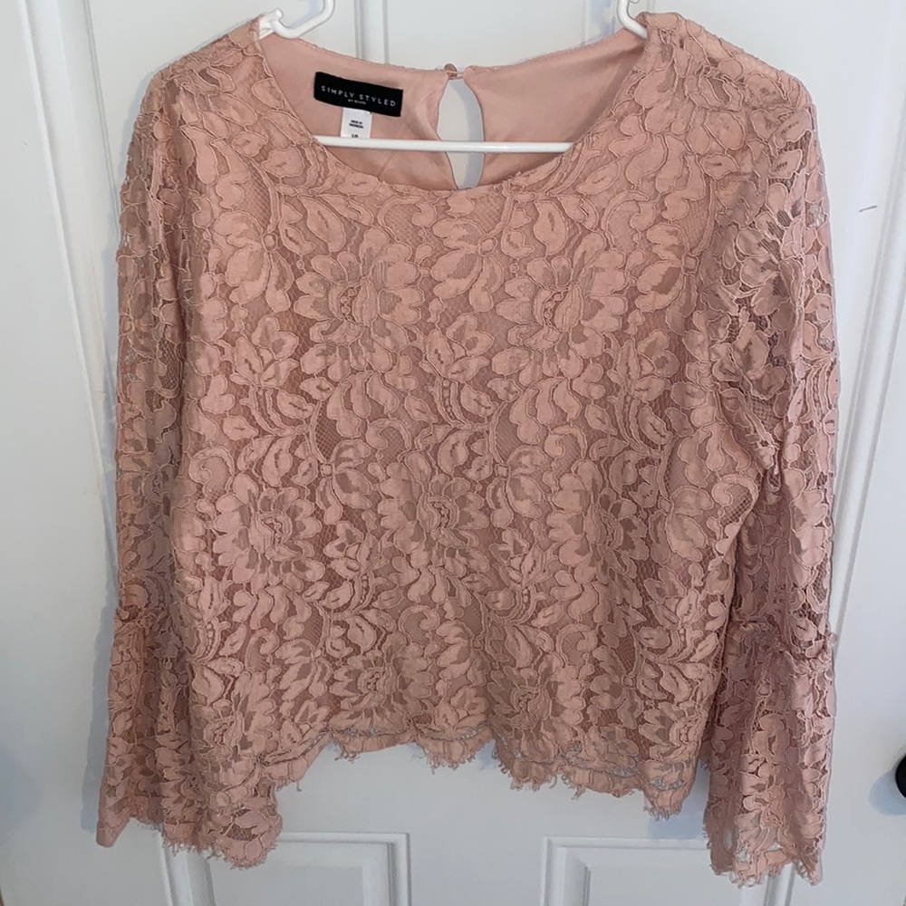 Blush lace top with bell sleeves.